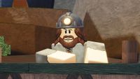 One of the shop NPCs in the Roblox game The Forge. He's got brown hair with a bear and is wearing a flashlight helmet, like a miner would. 
