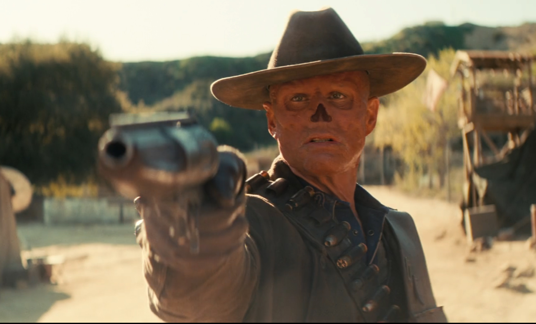 The Ghoul from Fallout pointing a gun