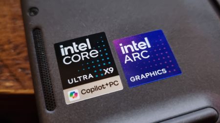 Two badges for the Intel Core Ultra X9 chip and Intel Arc graphics inside a gaming laptop