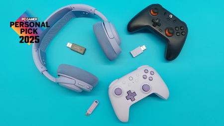 Various bits of purple PC gear--a set of gaming headphones, two controllers with 2.4 Ghz dongles, and a teeny-tiny USB--on a blue background. The 'PC Gamer Personal Pick 2025' badge floats in the top-left corner.